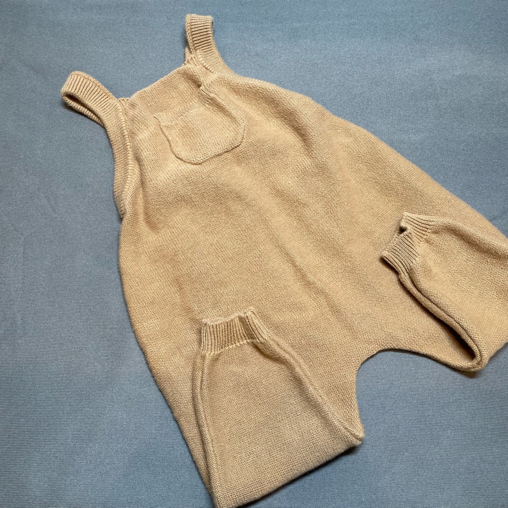 Quincy Mae knitted baby overalls.